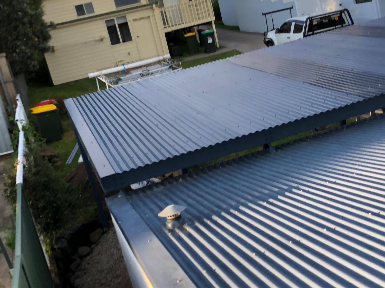 New corrugated steel roof over a pergola, seen from above